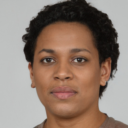 Neutral black young-adult female with short  black hair and brown eyes