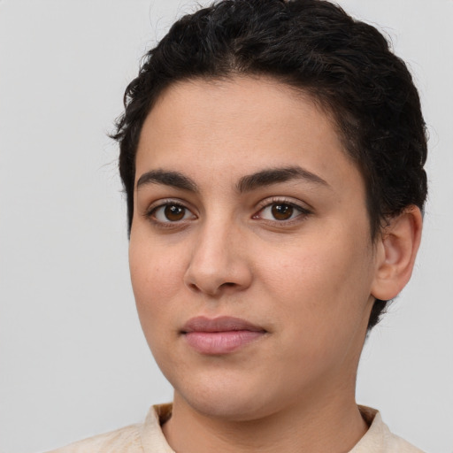 Joyful white young-adult female with short  brown hair and brown eyes