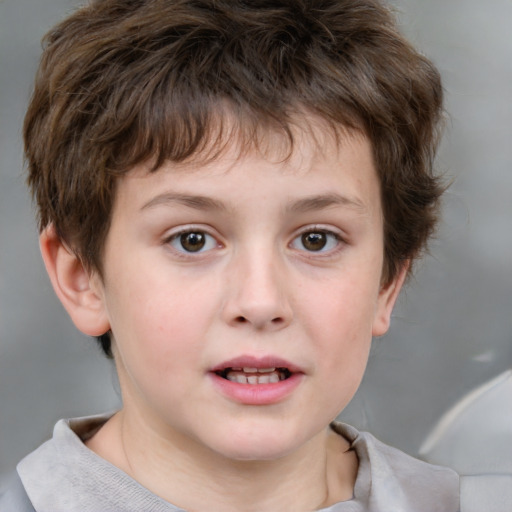 Joyful white child male with short  brown hair and brown eyes