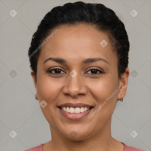 Joyful latino adult female with short  brown hair and brown eyes