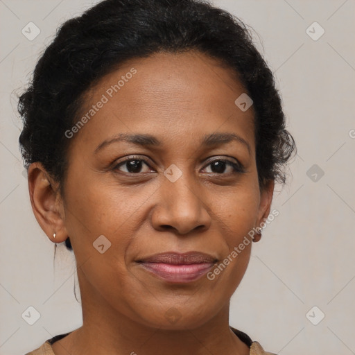 Joyful black adult female with short  brown hair and brown eyes