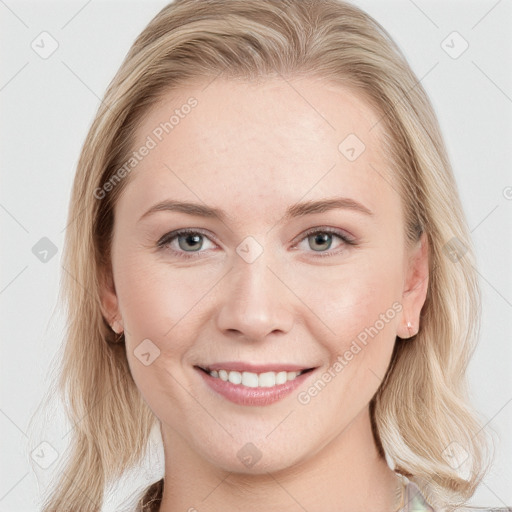 Joyful white young-adult female with long  brown hair and blue eyes