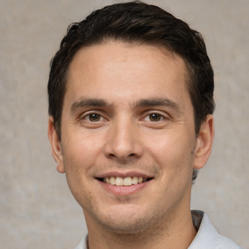 Joyful white young-adult male with short  brown hair and brown eyes