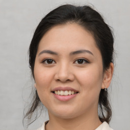 Joyful asian young-adult female with medium  brown hair and brown eyes