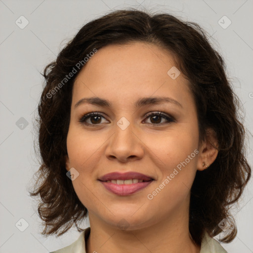 Joyful latino young-adult female with medium  brown hair and brown eyes