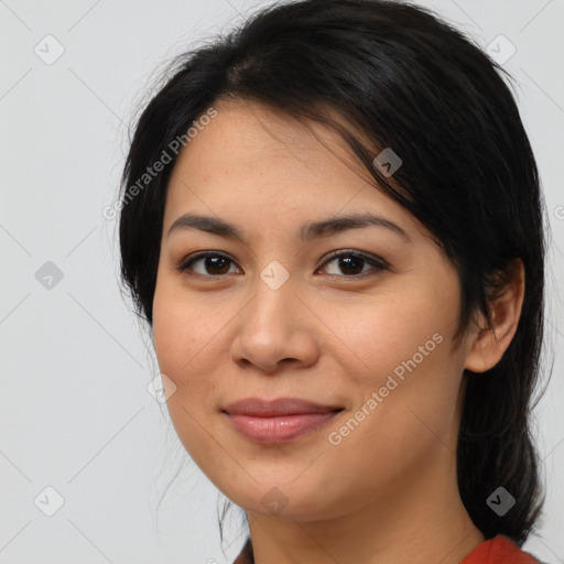 Joyful latino young-adult female with medium  brown hair and brown eyes