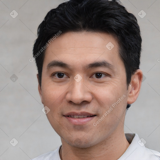 Joyful white young-adult male with short  black hair and brown eyes