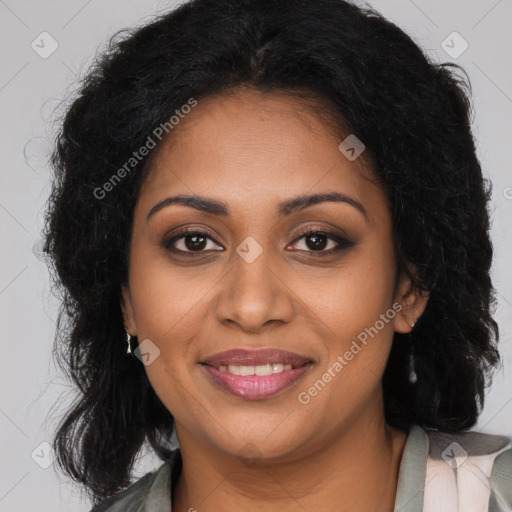 Joyful black young-adult female with long  brown hair and brown eyes