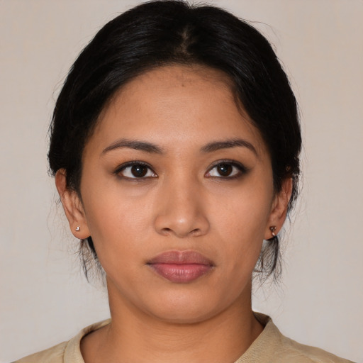 Neutral latino young-adult female with medium  black hair and brown eyes