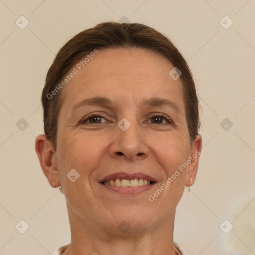 Joyful white adult female with short  brown hair and brown eyes