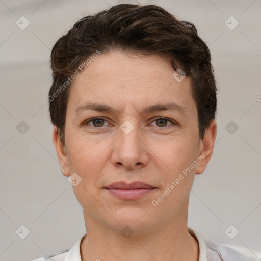 Joyful white adult female with short  brown hair and brown eyes