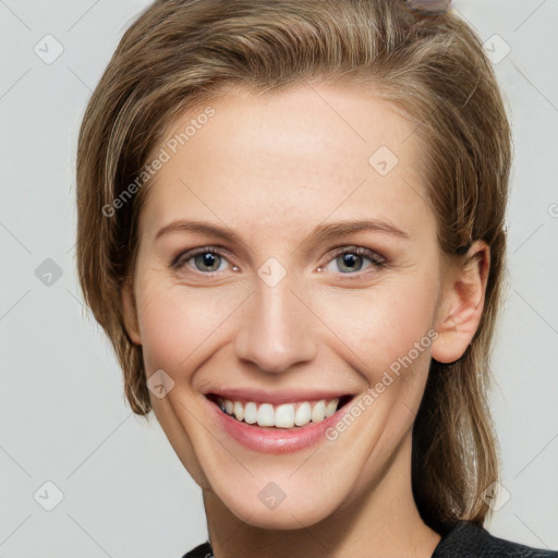 Joyful white young-adult female with medium  brown hair and grey eyes