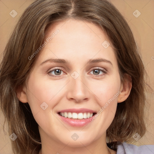 Joyful white young-adult female with medium  brown hair and green eyes