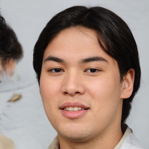 Joyful white young-adult male with medium  brown hair and brown eyes