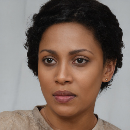 Neutral black young-adult female with short  black hair and brown eyes