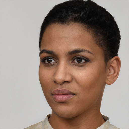 Joyful latino young-adult female with short  black hair and brown eyes
