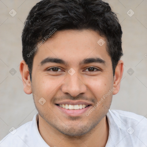 Joyful latino young-adult male with short  brown hair and brown eyes