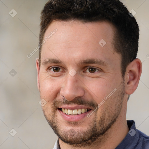 Joyful white adult male with short  brown hair and brown eyes