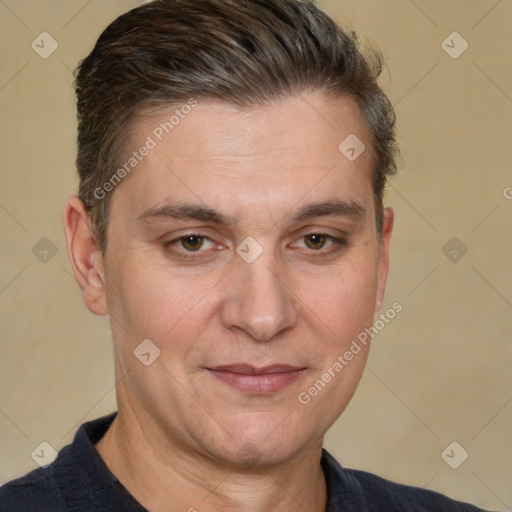 Joyful white adult male with short  brown hair and brown eyes