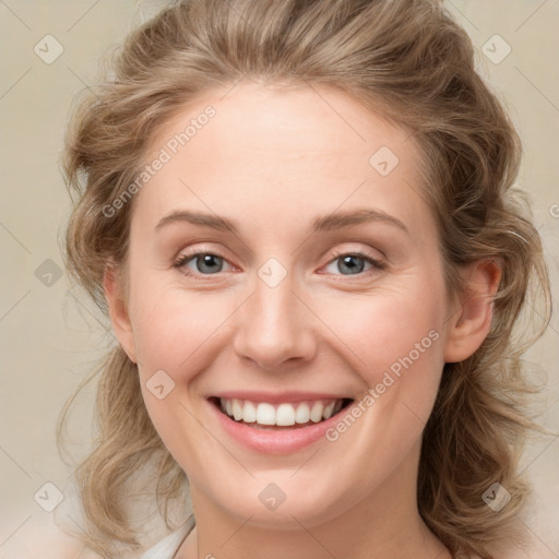 Joyful white young-adult female with medium  brown hair and green eyes