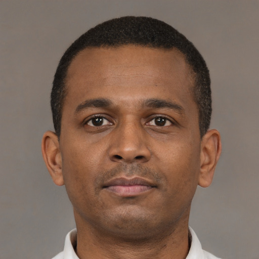 Neutral black young-adult male with short  brown hair and brown eyes