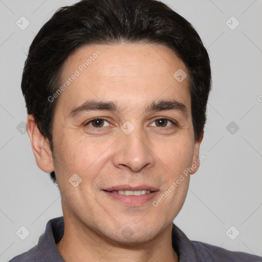 Joyful white adult male with short  brown hair and brown eyes