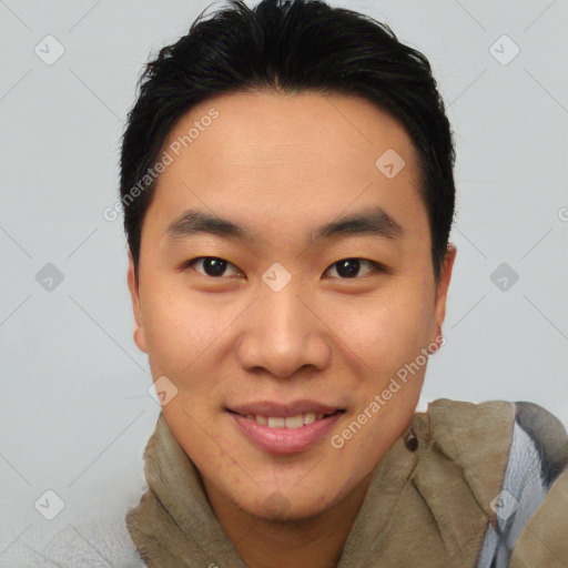 Joyful asian young-adult male with short  brown hair and brown eyes