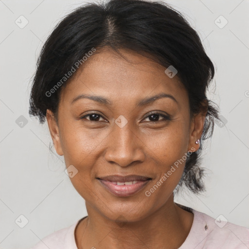 Joyful black adult female with medium  brown hair and brown eyes