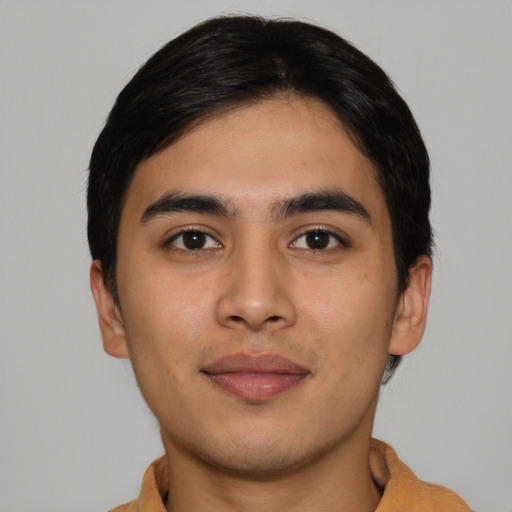 Joyful asian young-adult male with short  brown hair and brown eyes