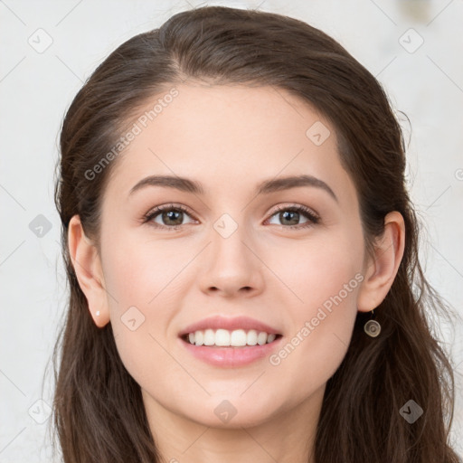 Joyful white young-adult female with long  brown hair and grey eyes