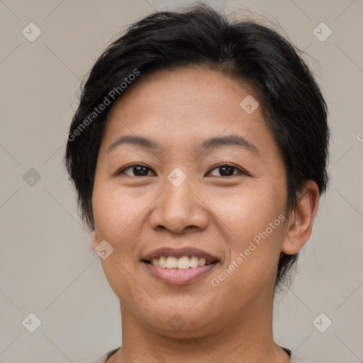 Joyful white adult female with short  brown hair and brown eyes