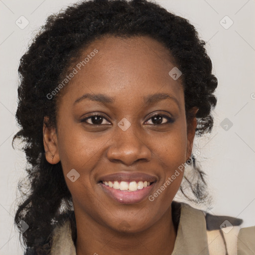 Joyful black young-adult female with long  brown hair and brown eyes