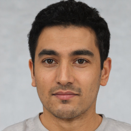 Neutral latino young-adult male with short  black hair and brown eyes