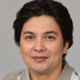 Joyful white adult male with medium  brown hair and brown eyes