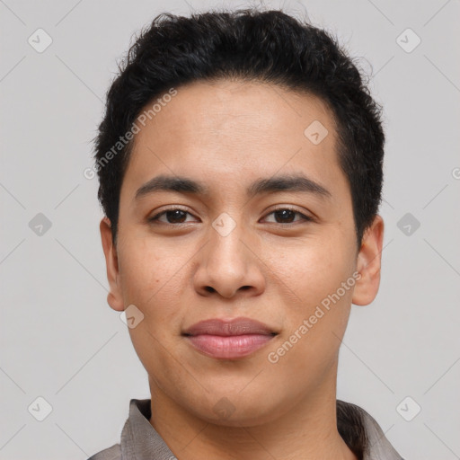 Joyful latino young-adult male with short  black hair and brown eyes