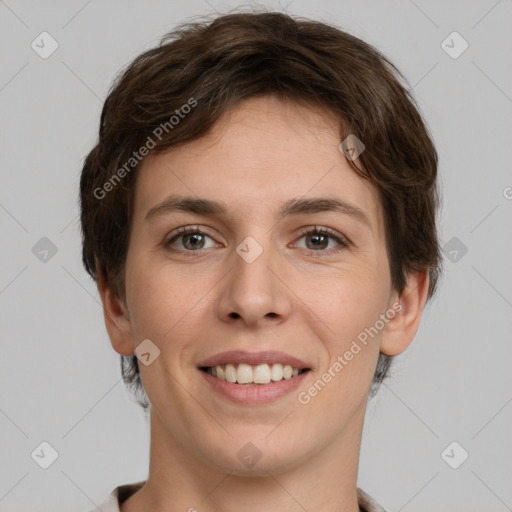 Joyful white young-adult female with short  brown hair and grey eyes