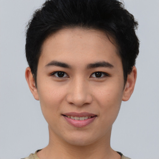 Joyful asian young-adult female with short  brown hair and brown eyes
