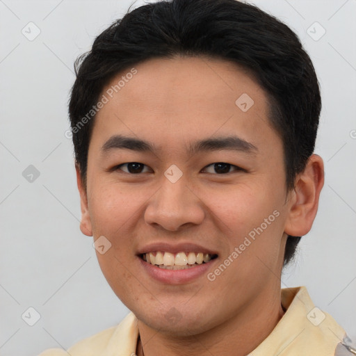 Joyful asian young-adult male with short  brown hair and brown eyes