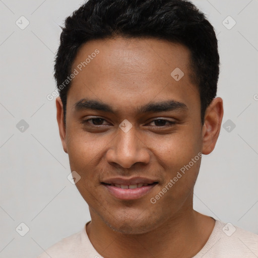 Joyful latino young-adult male with short  black hair and brown eyes