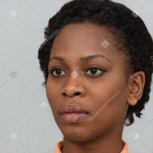 Neutral black young-adult female with short  black hair and brown eyes