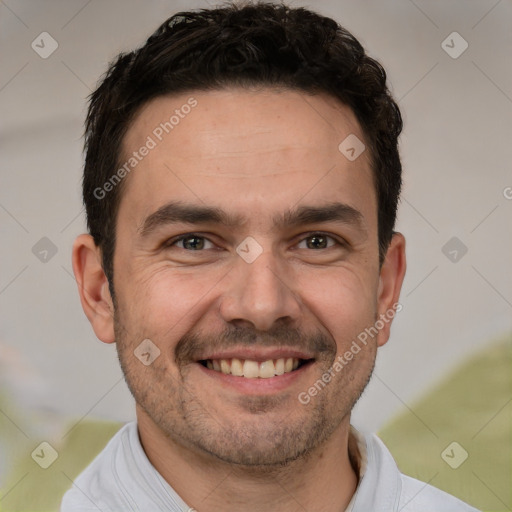 Joyful white adult male with short  brown hair and brown eyes