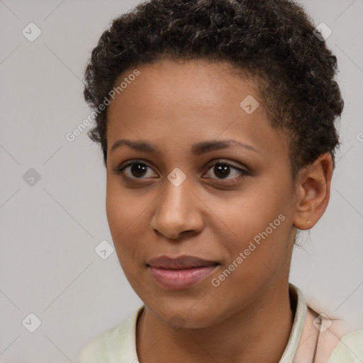 Joyful black young-adult female with short  brown hair and brown eyes