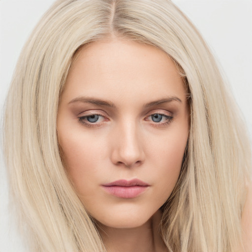 Neutral white young-adult female with long  blond hair and brown eyes