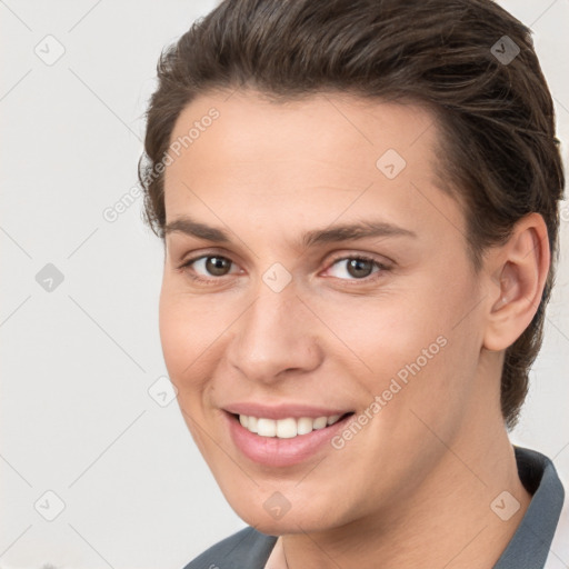 Joyful white young-adult female with short  brown hair and brown eyes