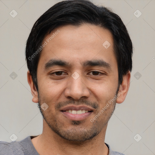 Joyful asian young-adult male with short  black hair and brown eyes