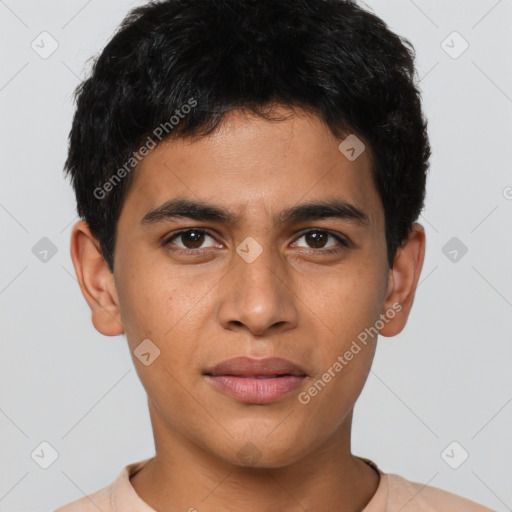 Joyful latino young-adult male with short  brown hair and brown eyes