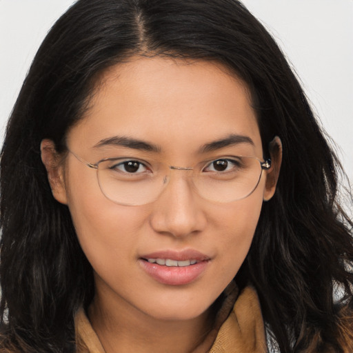 Joyful asian young-adult female with long  brown hair and brown eyes