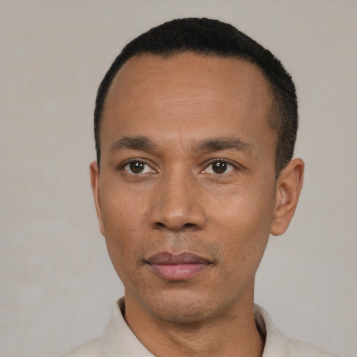 Neutral black adult male with short  black hair and brown eyes