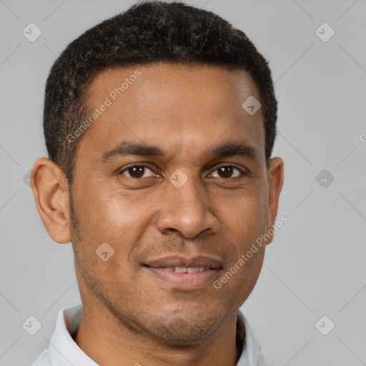 Joyful latino adult male with short  brown hair and brown eyes