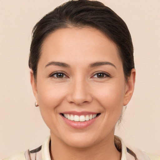 Joyful white young-adult female with medium  brown hair and brown eyes